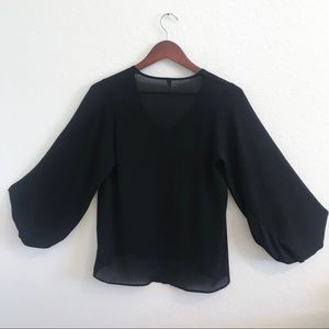Black long sleeve shirt V neck.